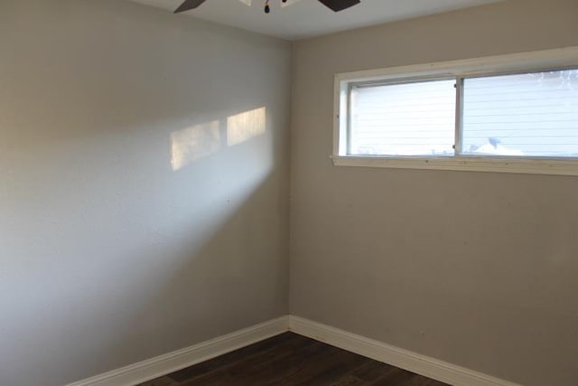 unfurnished room featuring ceiling fan and dark hardwood / wood-style flooring