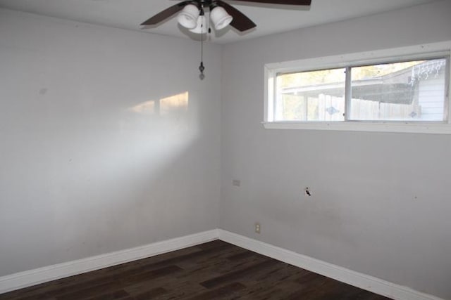 unfurnished room with dark hardwood / wood-style floors and ceiling fan