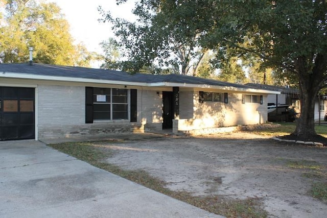 ranch-style house featuring a garage