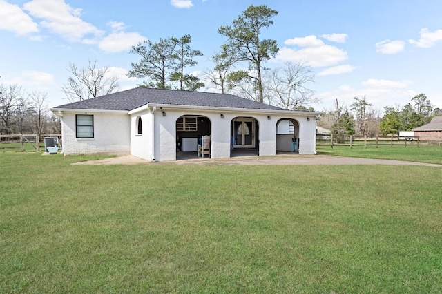 view of front facade with a front yard and central air condition unit