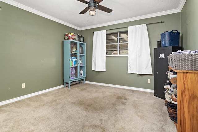 interior space with crown molding, ceiling fan, and carpet