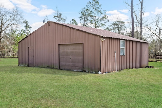 garage featuring a yard