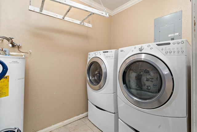 clothes washing area with crown molding, washing machine and dryer, water heater, and light tile patterned floors