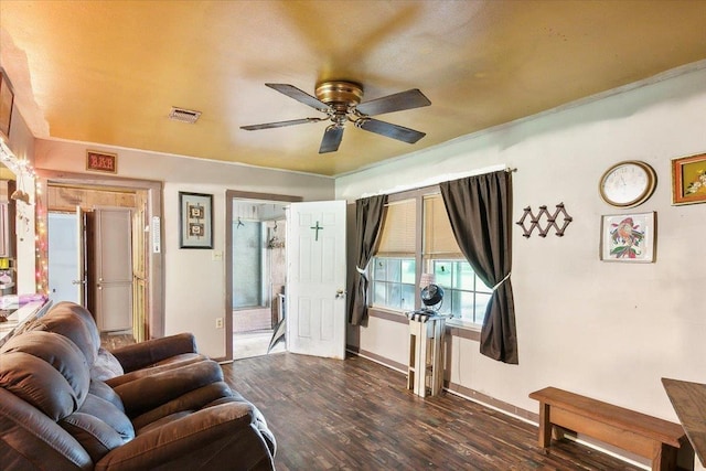 living room with ceiling fan and dark hardwood / wood-style flooring