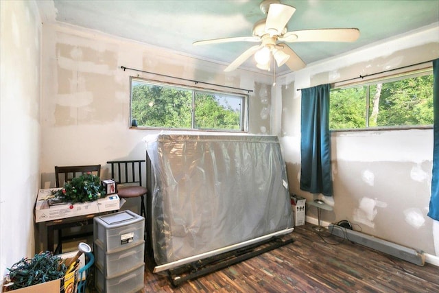 interior space with ceiling fan and dark wood-type flooring