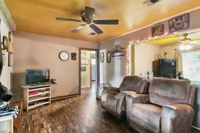 living room with dark hardwood / wood-style floors and ornamental molding