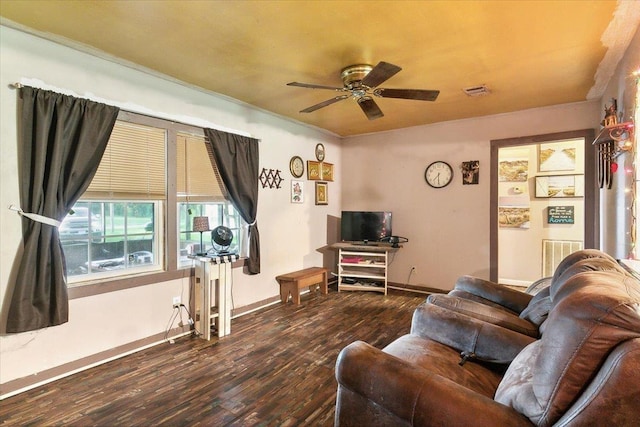 living room featuring hardwood / wood-style flooring and ceiling fan