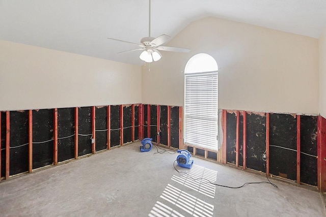 spare room featuring ceiling fan and vaulted ceiling