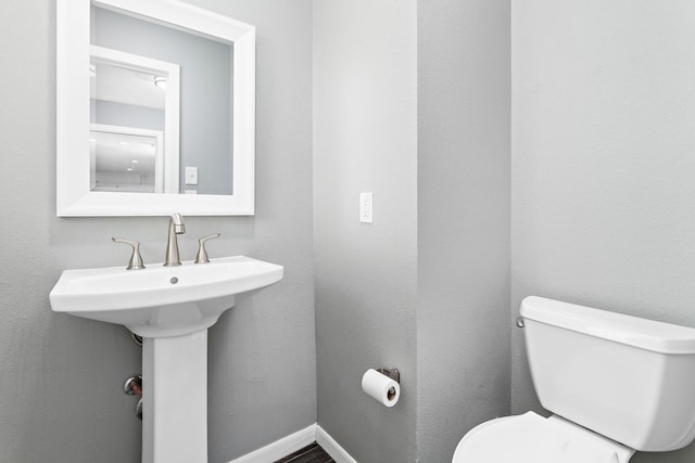 bathroom with sink and toilet