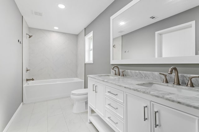 full bathroom featuring vanity, toilet, and tiled shower / bath combo