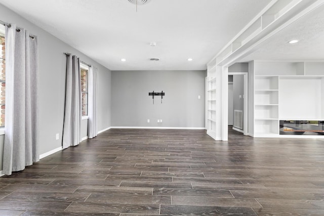 unfurnished living room with dark hardwood / wood-style floors