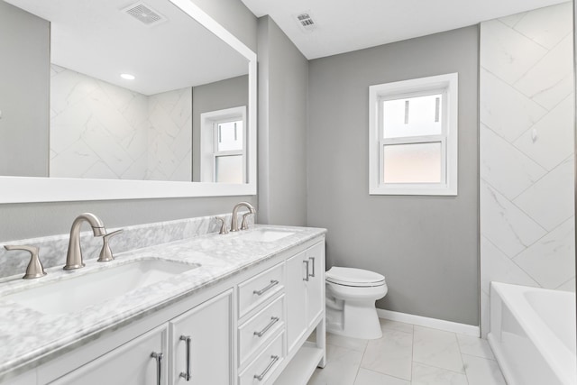 bathroom featuring vanity and toilet