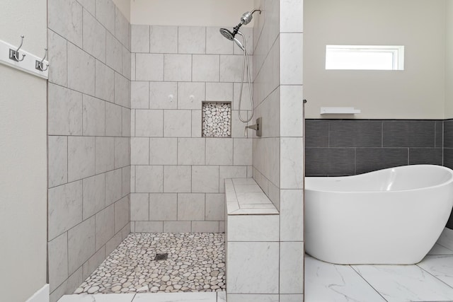 bathroom featuring separate shower and tub and tile walls