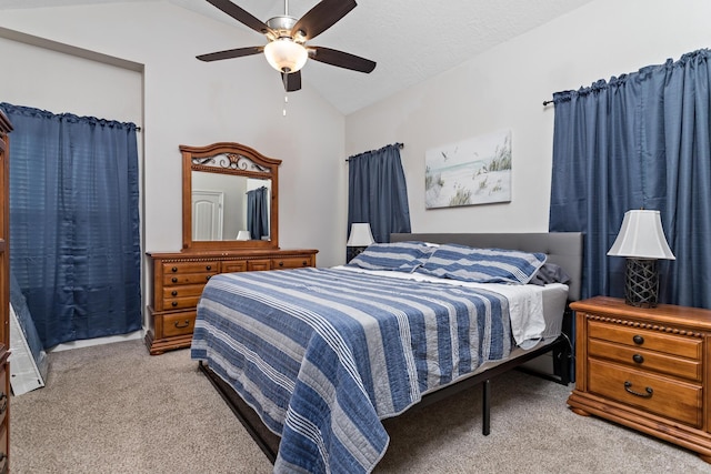 carpeted bedroom featuring ceiling fan and lofted ceiling