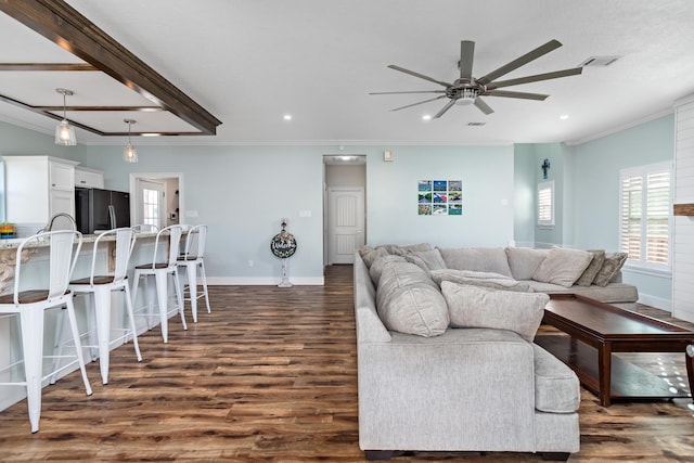 living room featuring dark hardwood / wood-style flooring, ceiling fan, and crown molding