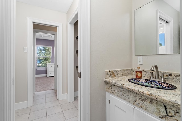 bathroom with tile patterned floors and vanity