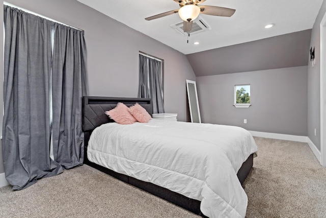 carpeted bedroom featuring vaulted ceiling and ceiling fan