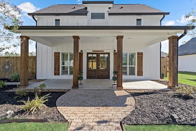 rear view of property featuring a patio area and french doors