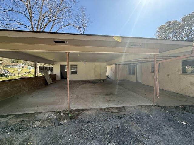 view of vehicle parking featuring a carport