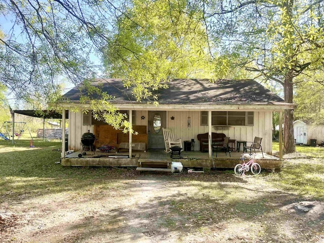 7521 Puntes Ln, Silsbee, TX 77659 - view of front of property featuring a shingled roof and board and batten siding