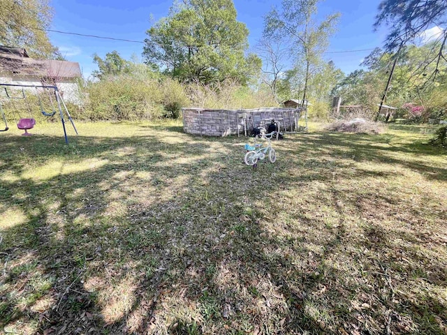 7521 Puntes Ln, Silsbee, TX 77659 - view of yard with a playground