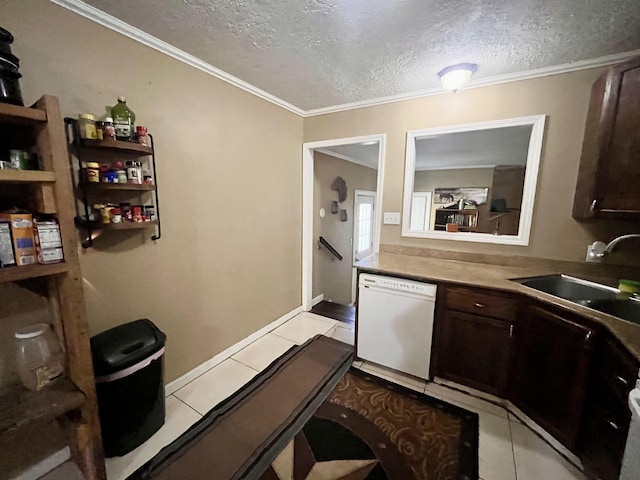 7521 Puntes Ln, Silsbee, TX 77659 - kitchen with light tile patterned flooring, a textured ceiling, dishwasher, dark brown cabinetry, and a sink
