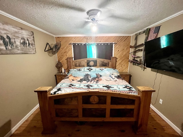 7521 Puntes Ln, Silsbee, TX 77659 - bedroom featuring wood walls, crown molding, and wood finished floors