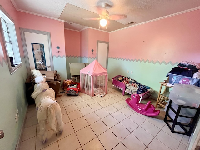 7521 Puntes Ln, Silsbee, TX 77659 - playroom with a textured ceiling, a ceiling fan, visible vents, and crown molding
