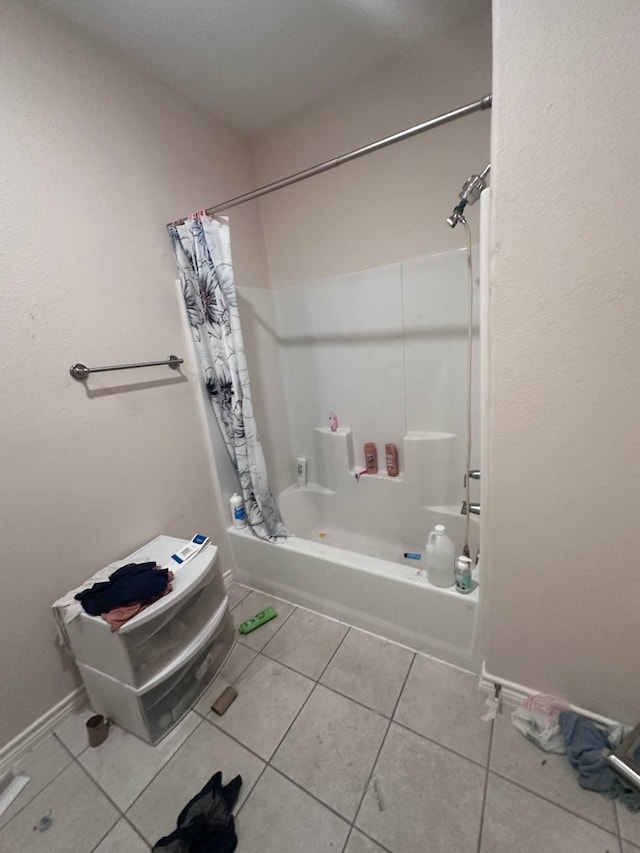 bathroom featuring tile patterned flooring and shower / tub combo