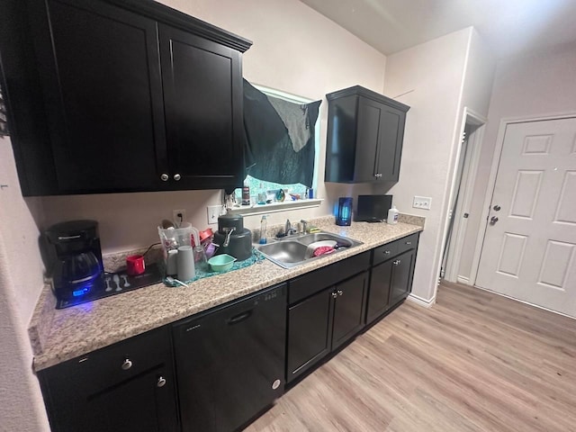 kitchen featuring black dishwasher, light wood-type flooring, and sink