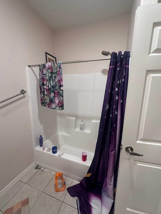 bathroom with tile patterned floors and shower / bathtub combination with curtain