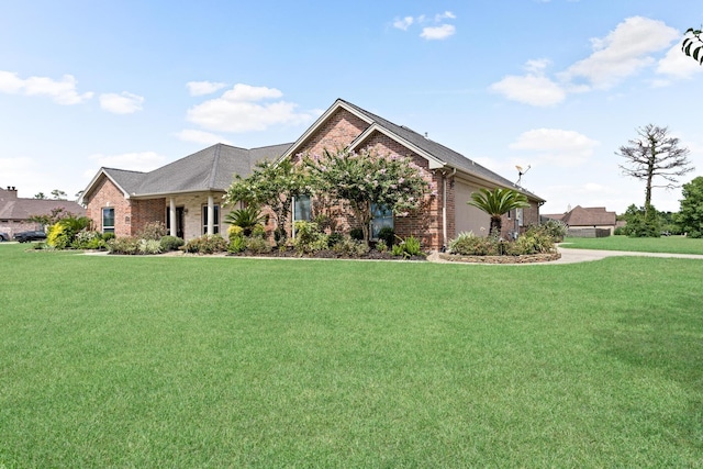 view of front of property featuring a garage and a front yard