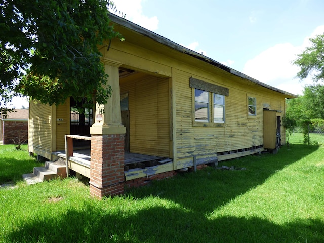 view of property exterior featuring a lawn