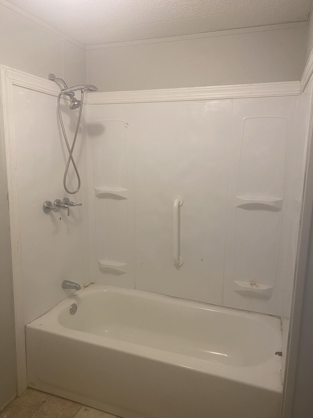 bathroom featuring tile patterned flooring and tub / shower combination