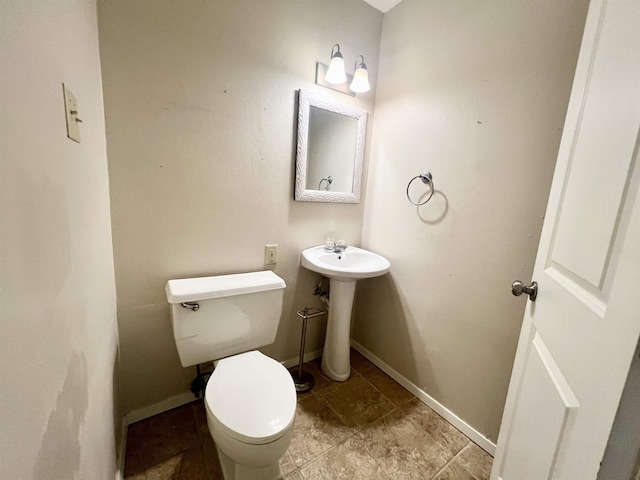 bathroom with toilet and sink