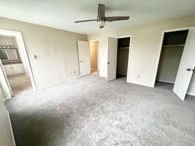 unfurnished bedroom featuring ceiling fan and light colored carpet