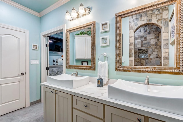 bathroom featuring tile patterned flooring, vanity, and ornamental molding