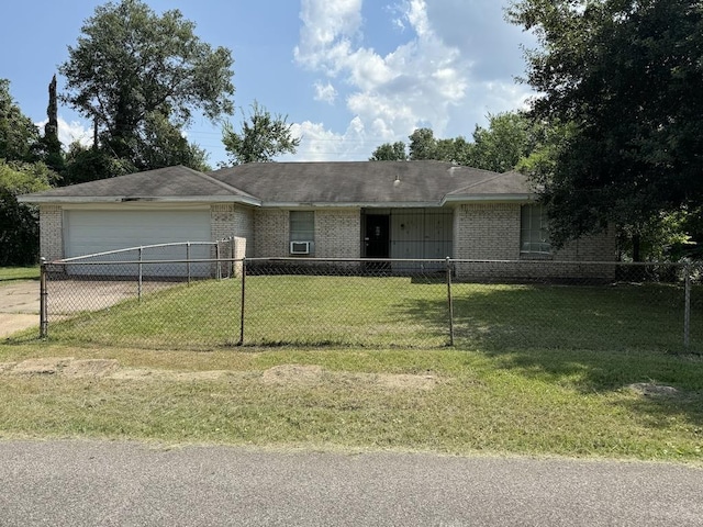 single story home featuring a front yard and a garage