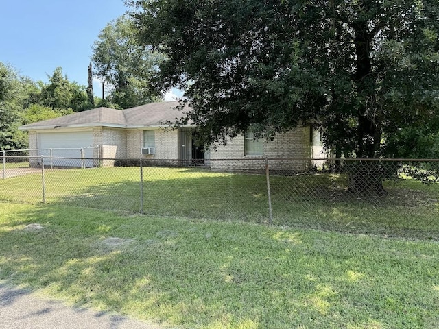 view of front of house with a garage and a front yard