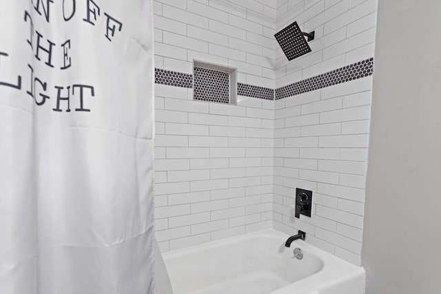 bathroom with shower / tub combo with curtain