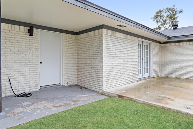 property entrance with a patio area