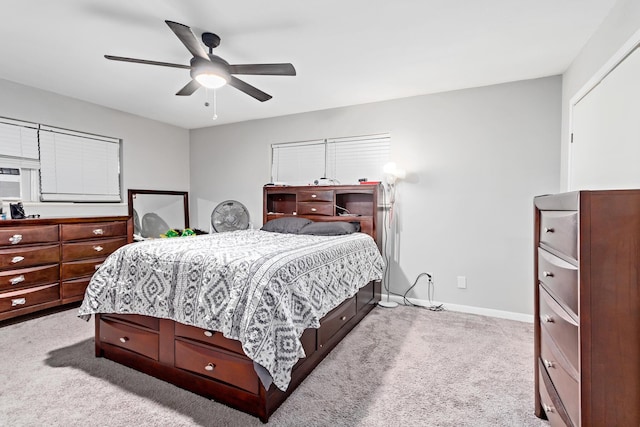 bedroom with light carpet and ceiling fan