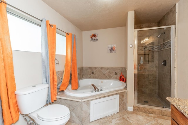 full bathroom with vanity, a textured ceiling, toilet, and separate shower and tub