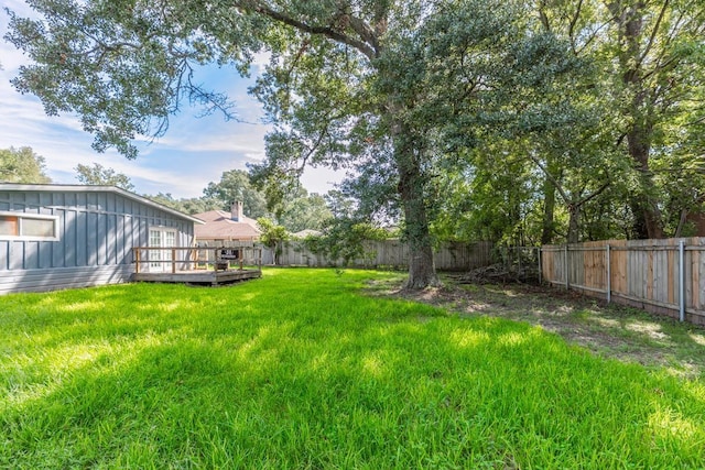 view of yard featuring a deck