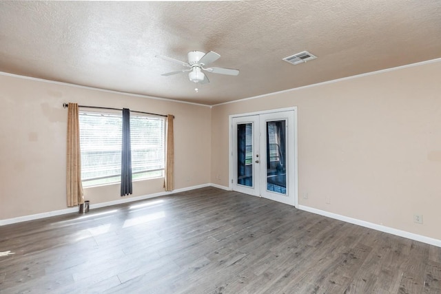 spare room featuring ceiling fan, french doors, a textured ceiling, and hardwood / wood-style flooring