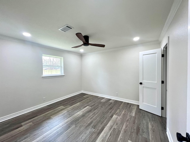 spare room with dark hardwood / wood-style flooring, ceiling fan, and crown molding