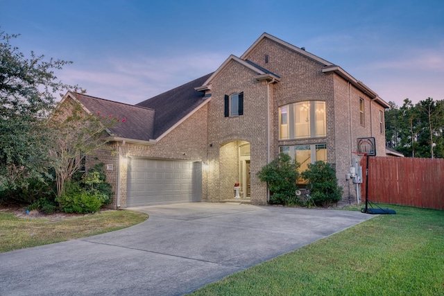 view of front property with a lawn and a garage