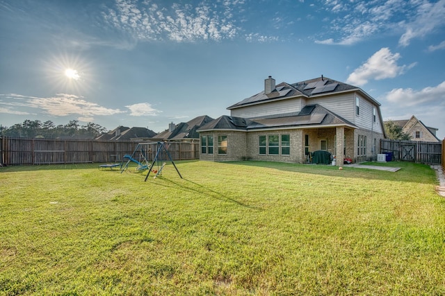 view of yard with a playground and central AC