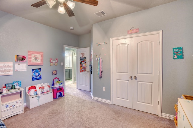 rec room featuring ceiling fan and light colored carpet