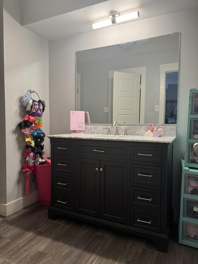 bathroom featuring vanity and wood-type flooring